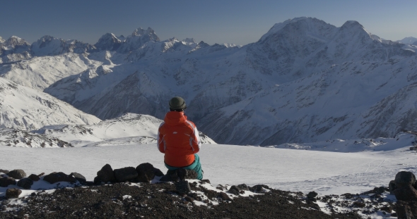Woman Enjoying the View of Winter Mountains
