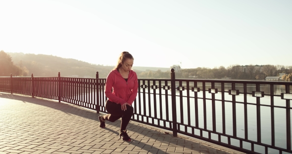 Young Girl in Pink Doing Fitness Exercises in Park at Sunset in Autumn alt