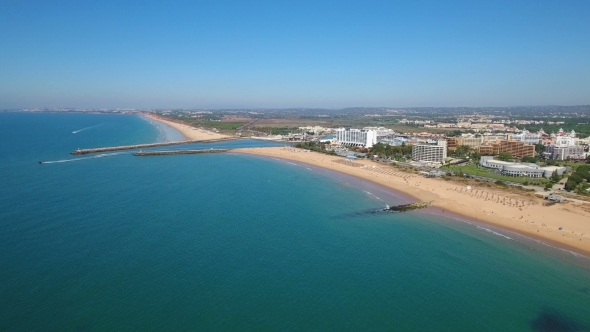 Aerial. Breakwaters Entrance To the Port of the Tourist Port of Vilamoura. alt