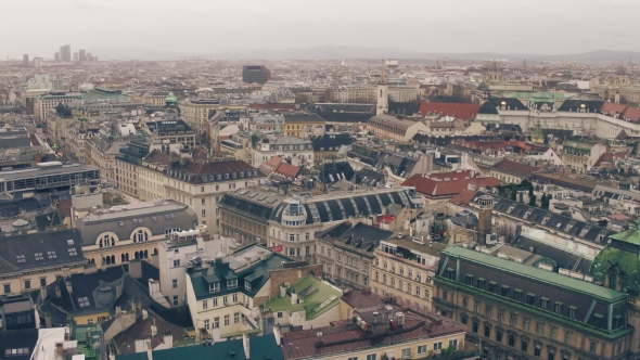 Old and Modern Buildings' Roofs in Vienna on a Cloudy Day alt