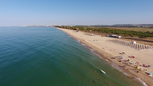 Falesia Beach, View From the Sky Sunbeds and Umbrellas To Tourists in the Summer. alt