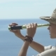 Young Travel Woman Looking In Spyglass At Horizon - VideoHive Item for Sale