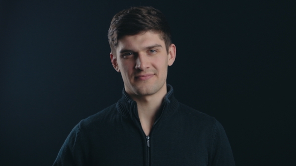 Rejecting, Young Man Gesture of No By Waving Finger. Black Background alt