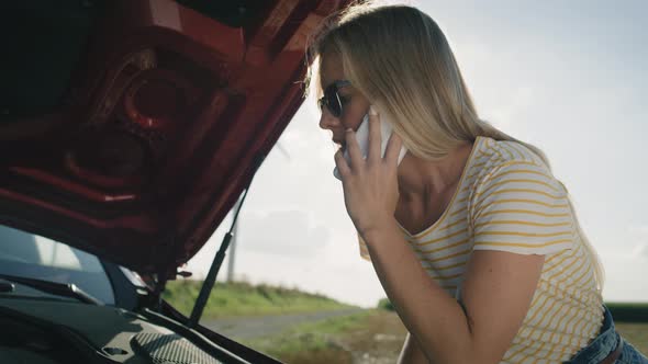 Video of woman calling her insurance after a car breakdown Shot with RED helium camera in 8K alt