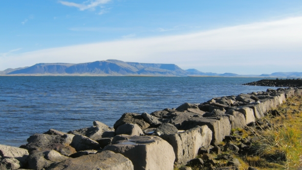 Embankment of Atlantic Ocean in Reykjavik, View of Esja Mountain, in Sunny Day