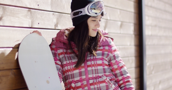 Smiling Woman in Pink Snowsuit with Board, Stock Footage | VideoHive