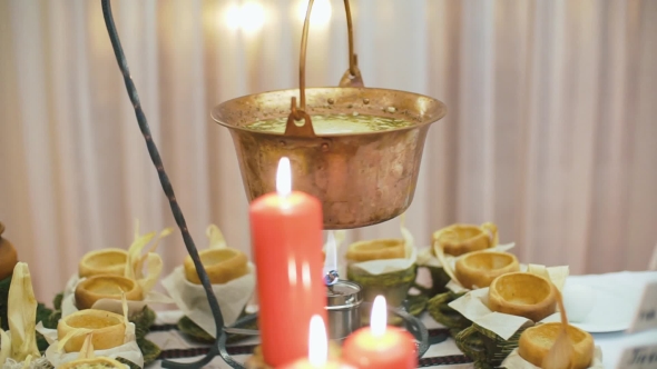Festive Dish Is Cooked in the Pot on a Buffet Table. alt