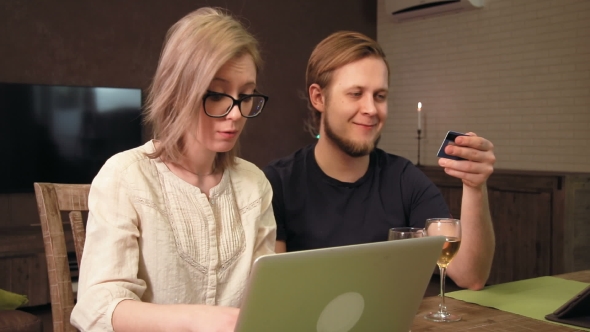 Young Couple Shopping Online with Their Laptop