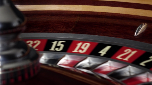 Usual Roulette Wheel Running with White Ball, Side View alt