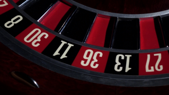 Usual Roulette Wheel Running with Fallen White Ball, Top View alt