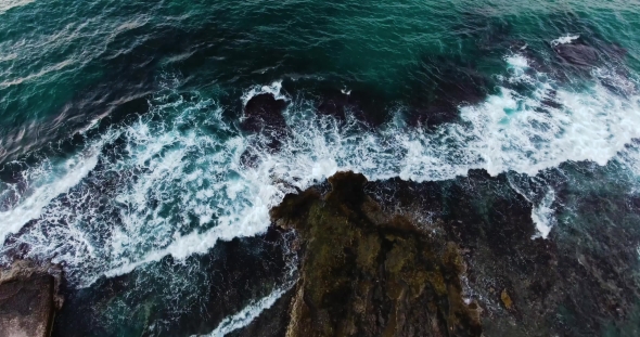 Flying Above Beautiful Wavy Seashore at Evening