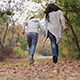 Mother and Son in the Park in Autumn Running Around - VideoHive Item for Sale