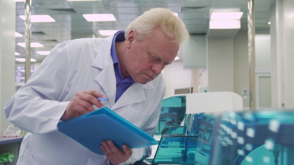 Man Notes Report About Laboratory Machine Work alt