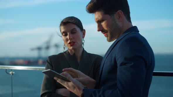 Happy Colleagues Looking Tablet in Sunlight Closeup alt