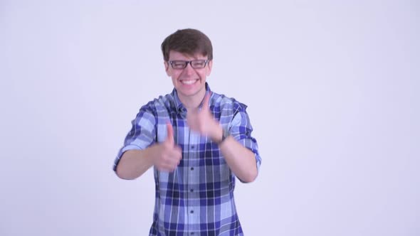 Happy Young Hipster Man Giving Thumbs Up and Looking Excited alt