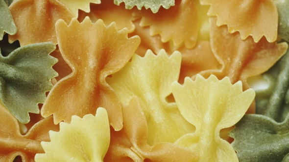 Uncooked Pasta in the Form of Ribbons of Different Colors, Stock Footage