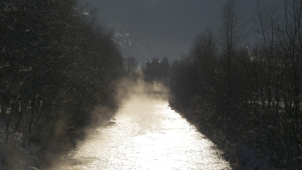 Steam Rises Over the Mountain River