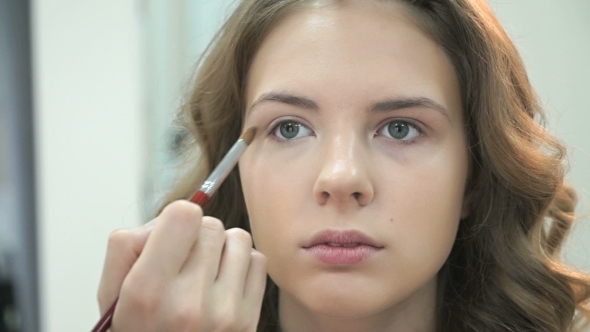Makeup Artist Apply Make Up To Young Girl