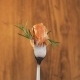 Rotating Fork With Salmon and Rosemary on Wooden Background - VideoHive Item for Sale