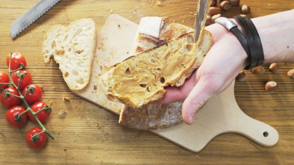 Buttering Bread With Peanut Butter alt