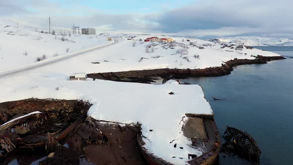 Aerial view of winter snowy sea coast alt