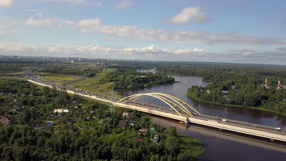Aerial. Cars Driving By the Road in Forest and River. alt