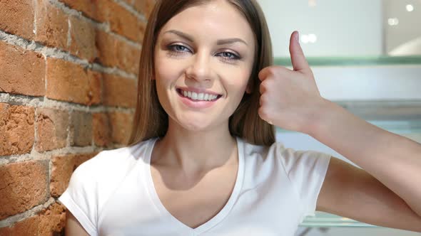 Thumbs Up by Young Woman, Positive gesture at Home alt