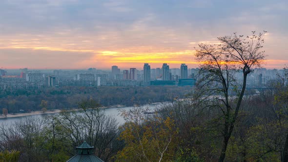 Panorama of Kyiv city and Dnipro river at sunrise, colorful autumn cityscape, 4k time lapse