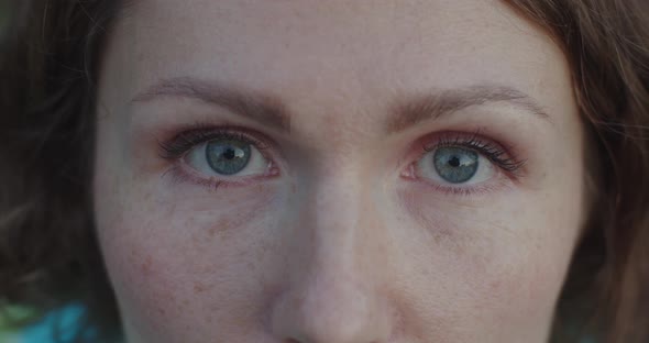 Extra Close Up Female Blue Eyes with Little Make-up Mascara Opening Slow Motion Detailed Crop. Macro