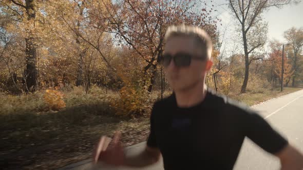 Running Man On Road Half Marathon. Triathlete Jogger Ready For Marathon And Hard Training Workout. alt