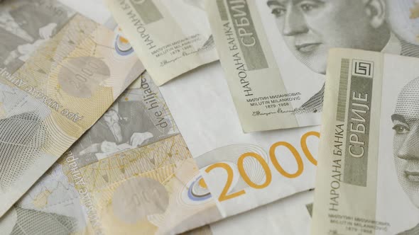 Offical banknotes of Serbian money and business background 4K 2160p 30fps UltraHD tilting footage -  alt