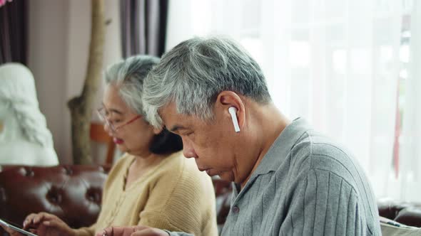 Senior man use wireless earphone to talking with telephone communication alt