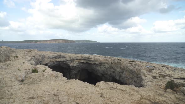 Waves Crashing in Coral Lagoon Shores Makes Water Geysers near Armier Bay in Mellieha alt