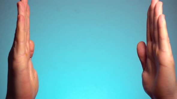 Man Clapping By Two Hands. Closeup View