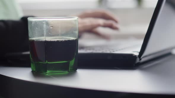 Woman Working on Laptop at Home Near Window Close Up Freelance Glass of Soda