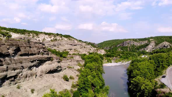 Aero. View From Above. Beautiful Landscape, in the Midst of Mountains and Trees, in Gorge There Is a alt