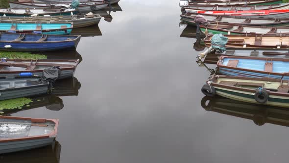 Fishing Boats Lined On Calm Inlet In Killarney National Park, Ring of Kerry, Ireland. high angle, ti alt