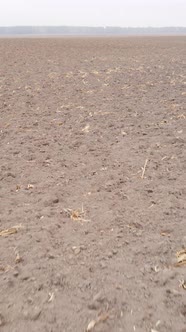 Vertical Video of a Field with Plowed Land in Autumn Slow Motion alt