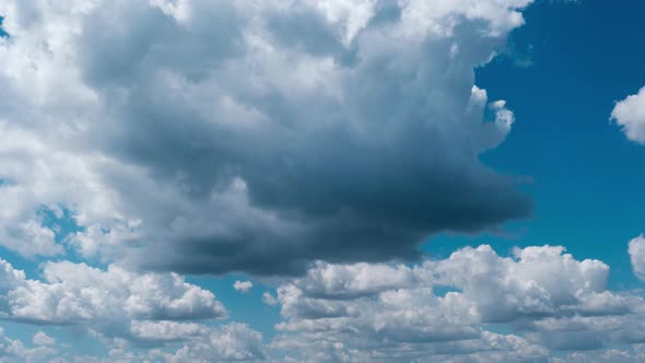 Timelapse of Light White Puffy Clouds Moving in the Blue Sky Cloud Space alt