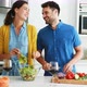 Couple preparing food together in the kitchen