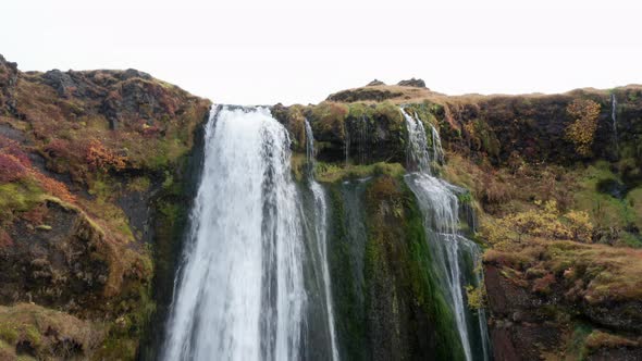 Drone Of Waterfall With Flowing Water Over Cliff alt