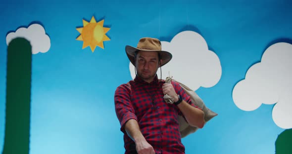 Man with Sack Pretends Horseback Riding alt