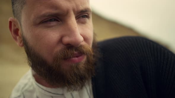 Thoughtful Man Face Looking Away on Nature Background alt