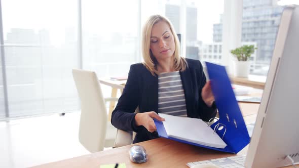 Businesswoman working on computer alt