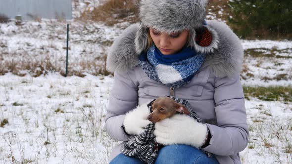 Worried Girl with Frozen Dog Outside