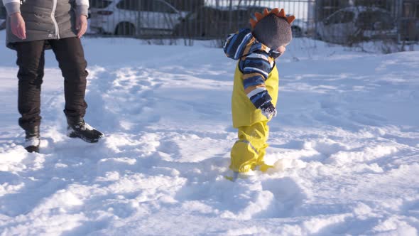 Child in Yellow Waterproof Rain Pants Bibs for Kids on Walk in Cold Season One Year Old Baby Boy alt