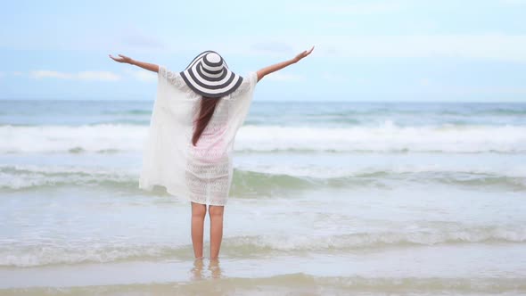 Asian woman enjoy around beautiful beach sea ocean alt