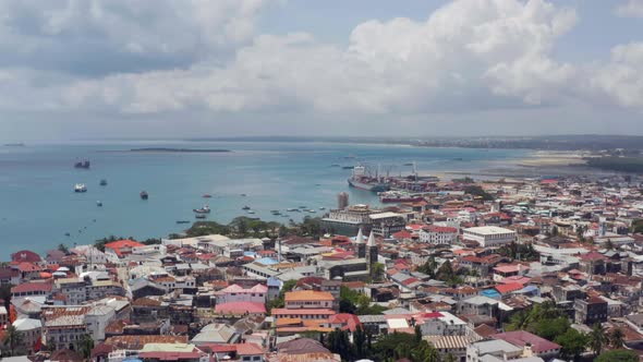 Drone Flying Over the Shoreline in Stone Town Zanzibar Tanzania alt
