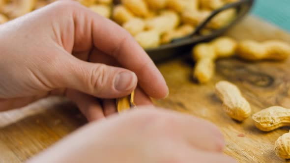 The Woman Peels the Peanuts From the Retro Tray alt