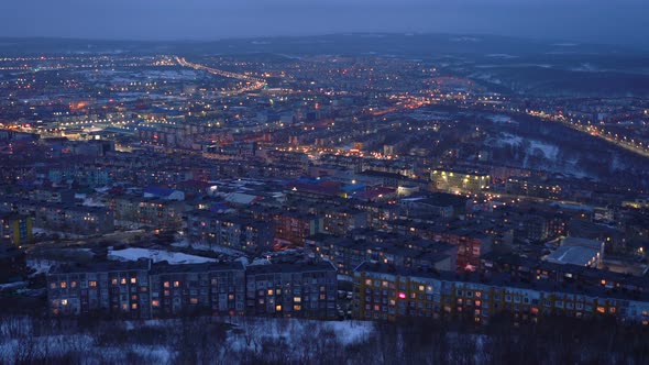 Night Top View of Residential Buildings and Illuminated City Roads